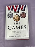 Front cover showing title, author and medal artwork