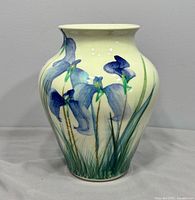 Front view of vase showing hand-painted iris design