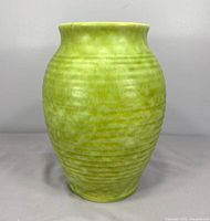 Full frontal view showing entire vase, color and ribbed texture