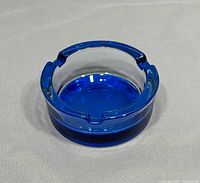 top angle view showing cobalt blue ashtray overall form and rests