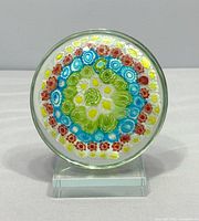 front view of Murano millefiori paperweight on stand