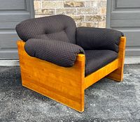 Front angled view showing oak frame and upholstered cushions