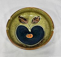 Top view showing full ashtray and apple design