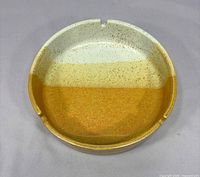 Top view showing full ashtray, glaze pattern, and two of three cigarette rests