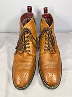 Front view showing lace-up design, brogue perforations and overall condition