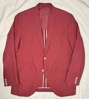 Front view of red Hackett blazer showing two-button closure, flap pockets, chest pocket, cuffs