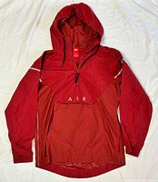 Full front view of Nike red windbreaker with hood and flap showing AIR lettering