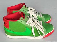 Left side view of both sneakers showing colorway and condition