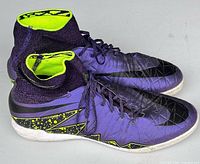 Left and right sides of pair showing purple uppers, collar, midsole trim