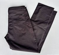 Full view of folded black pants