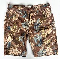Front view of floral shorts showing pattern and pockets