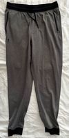 Front view of grey Under Armour jogger sweatpants showing overall design