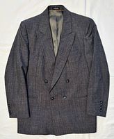 Front view of charcoal grey double-breasted blazer with four-button closure