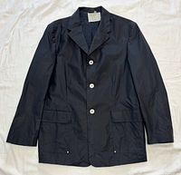 Front view of navy cotton Versace Jeans Couture jacket showing three white buttons, lapels and pockets