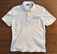 Full view of front of white Zegna polo shirt