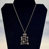 Full view of pendant on chain hanging