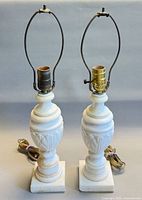 Front view of both alabaster marble lamps showing overall design and harps