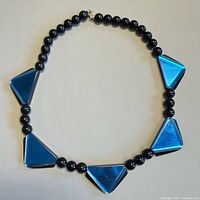 Full view of necklace laid flat showing bead pattern