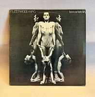 Front jacket displaying album title and mirrored figure artwork