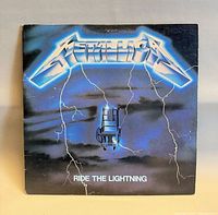 Front cover with Metallica logo and Ride The Lightning title