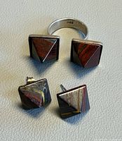 Ring and earrings set laid out showing stones and metal