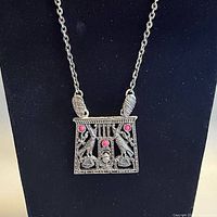 Necklace on display stand showing full view