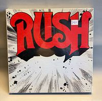 Front cover of sealed Rush LP showing large red logo and shrink sticker