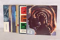 Stacked side view of records showing spine count and Rolling Stones Hot Rocks front cover