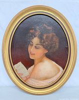 Frontal view of framed oval oil painting showing subject and frame