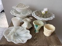 Full view of all ten glass pieces on tabletop