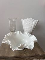 Group shot of ruffled bowl, fan vase, candlestick with hurricane