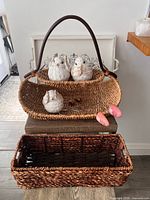 Overall lot showing two baskets, three bird figures, shoe stretchers, and serving tray