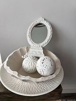 Tray, bowl, mirror, two decorative balls grouped