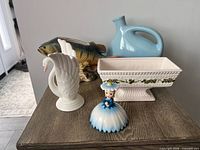 All five items grouped: fish figurine, swan vase, planter, jug, flower girl