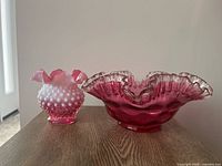 Front view of both Fenton pieces on table