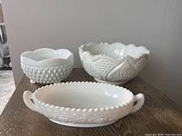 Three milk glass pieces grouped on table