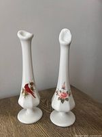 Front view of both Fenton milk glass bud vases
