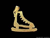 Front view of textured 10K gold ice skate pendant