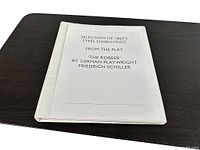 Front view of plastic-sleeved folder titled "Selection of 1860's Steel Engravings From the Play 'The Robber'"