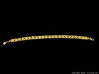 Full bracelet laid flat showing entire length and clasp
