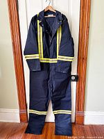Front view of navy coverall with hi-vis stripes