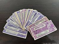 Fan arrangement of all 34 Canadian Tire 25¢ coupons