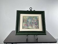 Framed print on stand showing full item front
