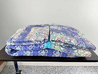 Folded quilt with shams stacked