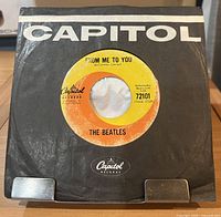 Front of record in black Capitol sleeve showing A-side label