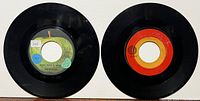 Two 45s: Apple 5371 and Capitol 5555 front labels