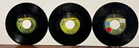 Three Apple-label Beatles 45s side A full-green Apple view