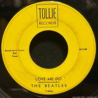 Side A label showing Love Me Do on yellow Tollie label