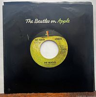 Front view of record in black The Beatles on Apple sleeve