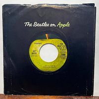 Front of sleeve displaying record through centre hole